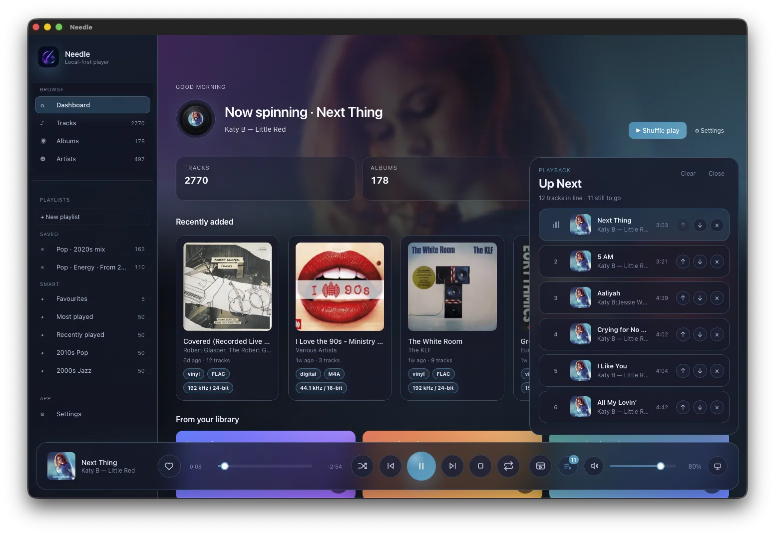 Needle's now-playing dashboard with an animated vinyl, album art, and an Up Next queue